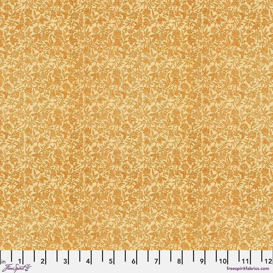 Orange cotton fabric with tiny leaf-like sprig print in lighter orange tones