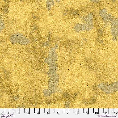 Yellow vintage-style fabric with mottled abstract texture, small tonal speckles