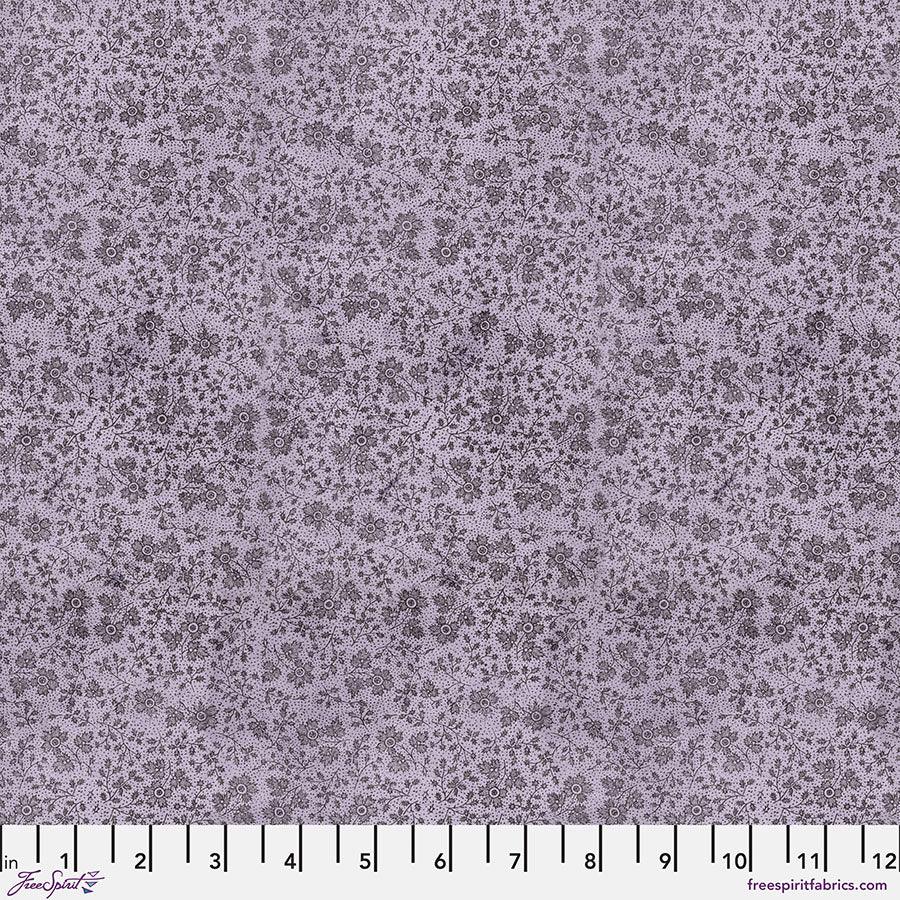 Purple quilting fabric with tiny repeating floral and star-like prints