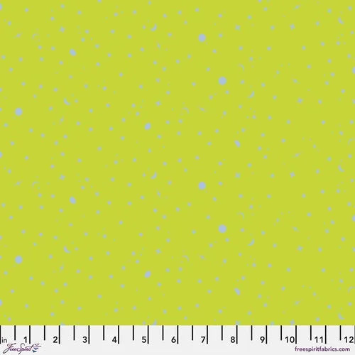 Lime green fabric with scattered small blue speckles and dots, quilting cotton yardage