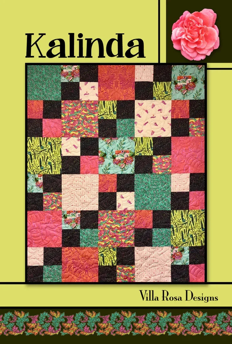 Kalinda quilt pattern featuring multicolor patchwork squares and floral blocks