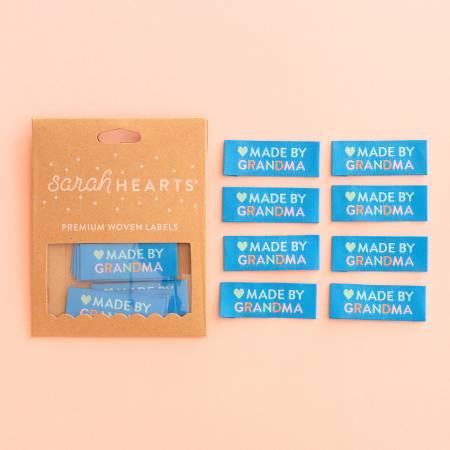 Made by Grandma woven clothing label set on cardboard backing with blue label pieces