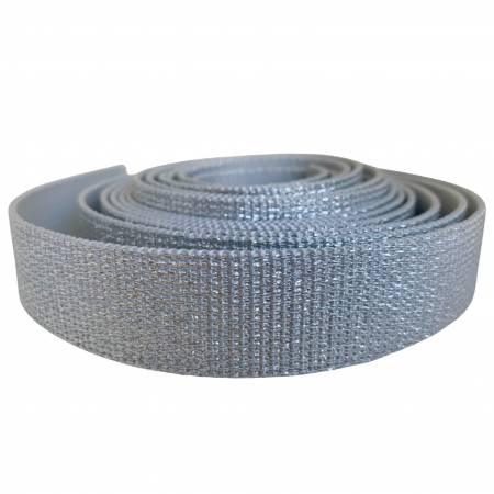 Silver glitter webbing trim roll with woven mesh texture and metallic sparkle