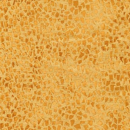 Gold fabric with abstract mosaic pattern of small irregular shapes