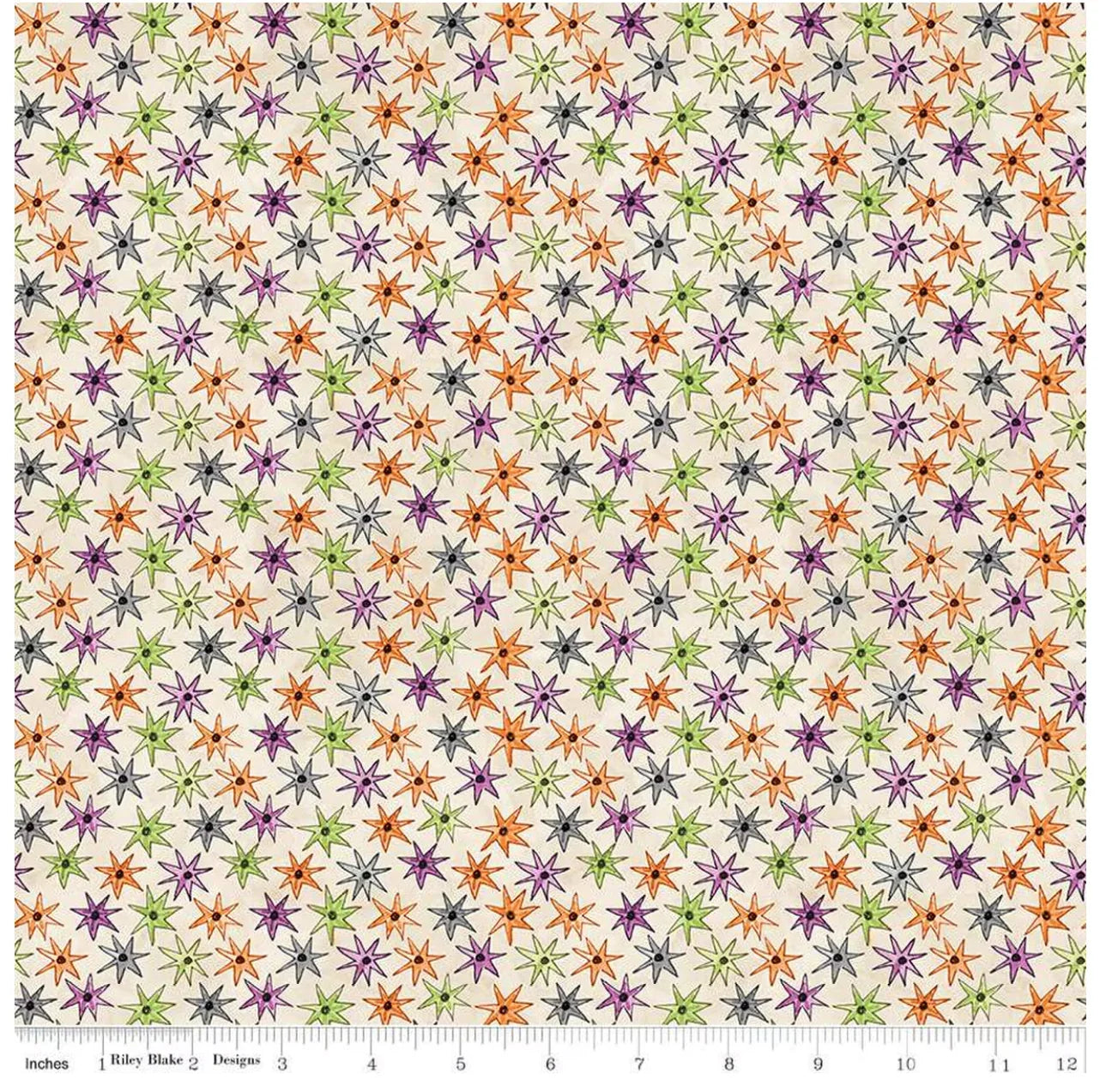 Cream fabric with multicolor starburst and small dot allover pattern