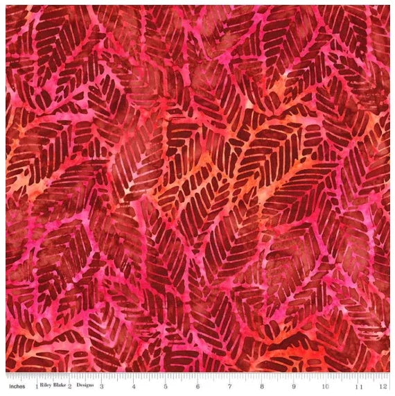 Batik fabric in red with pink and dark leaflike pattern
