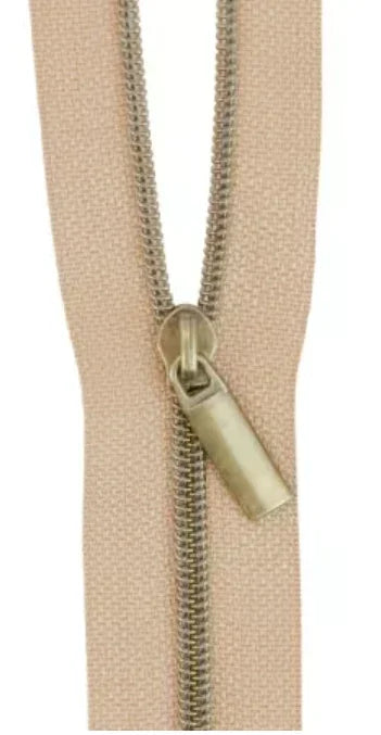 Beige nylon antique coil zipper with metal slider and pull tab