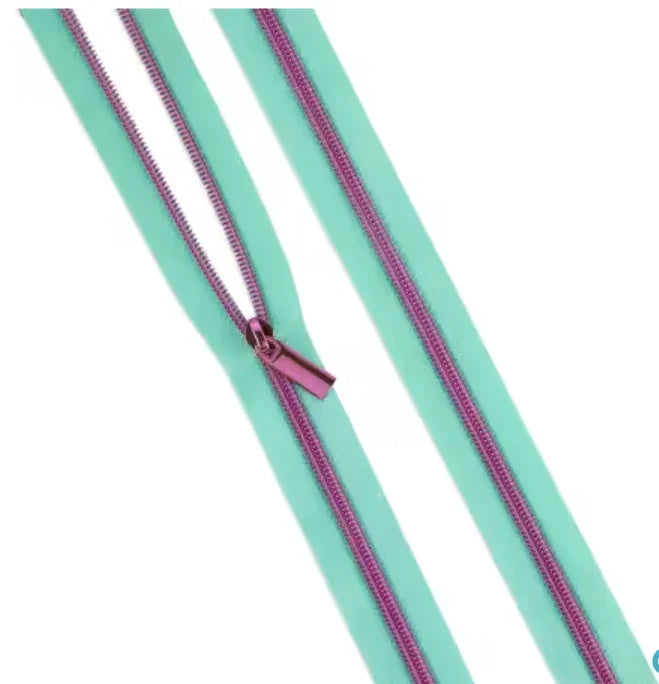 Nylon coil zipper trim with matching pull tab, dark purple coil on teal tape