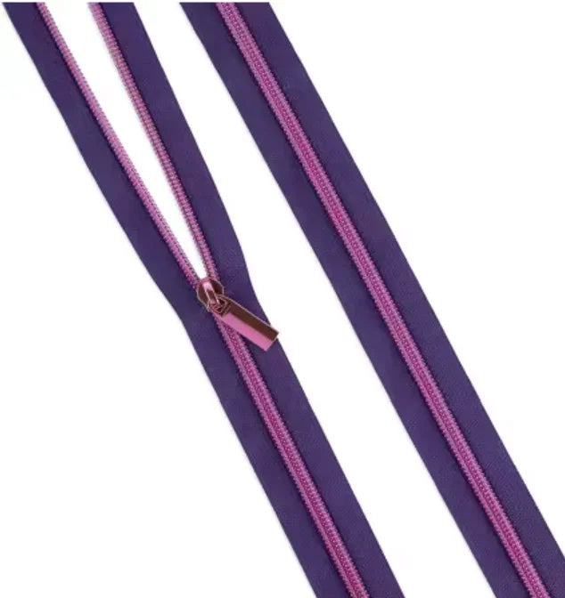 Nylon coil zipper trim with dark purple tape and pink coil, bronze slider