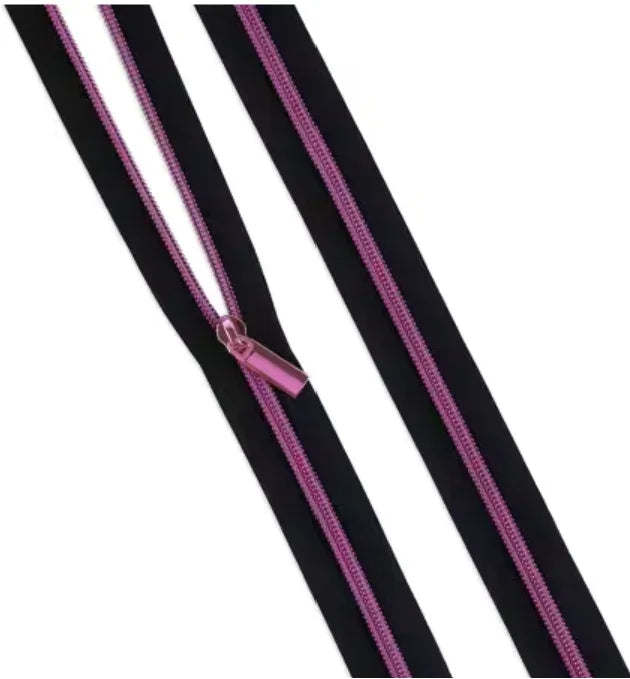 Coil zipper with black tape and magenta zipper teeth, with matching metal pull
