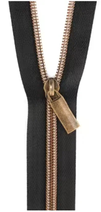 Black nylon antique coil zipper with brown metal pull tab