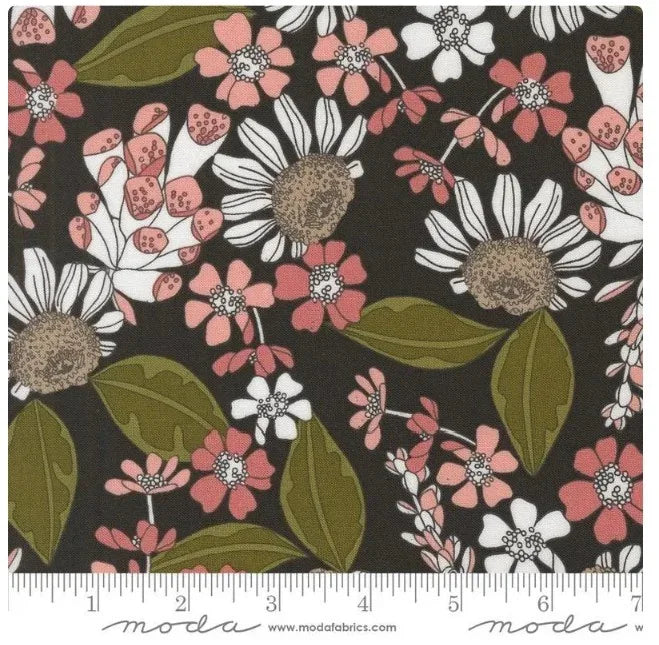 Floral quilting fabric in dark tones with pink flowers, white blooms, and green leaves