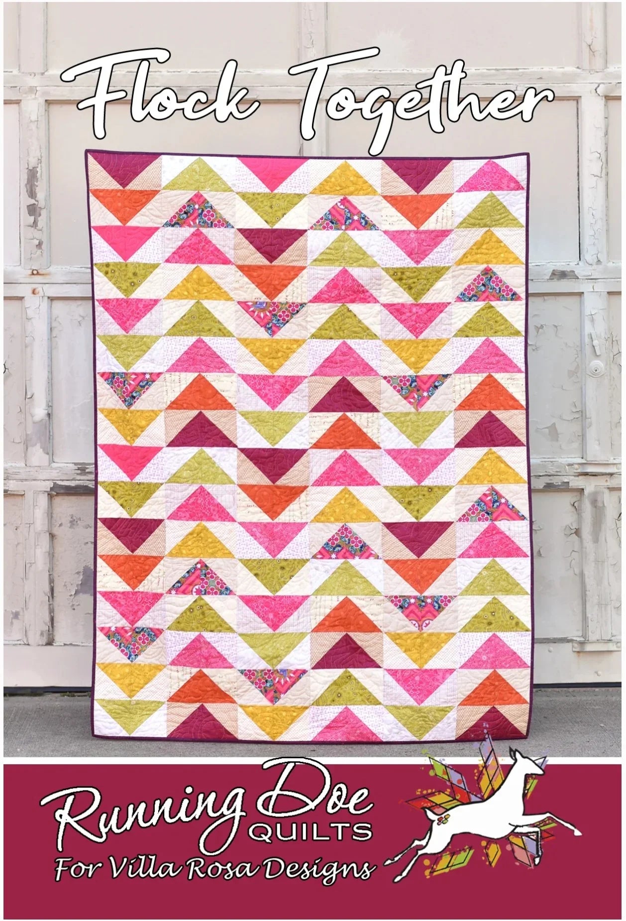 Quilt with multicolor geometric chevron triangle pattern