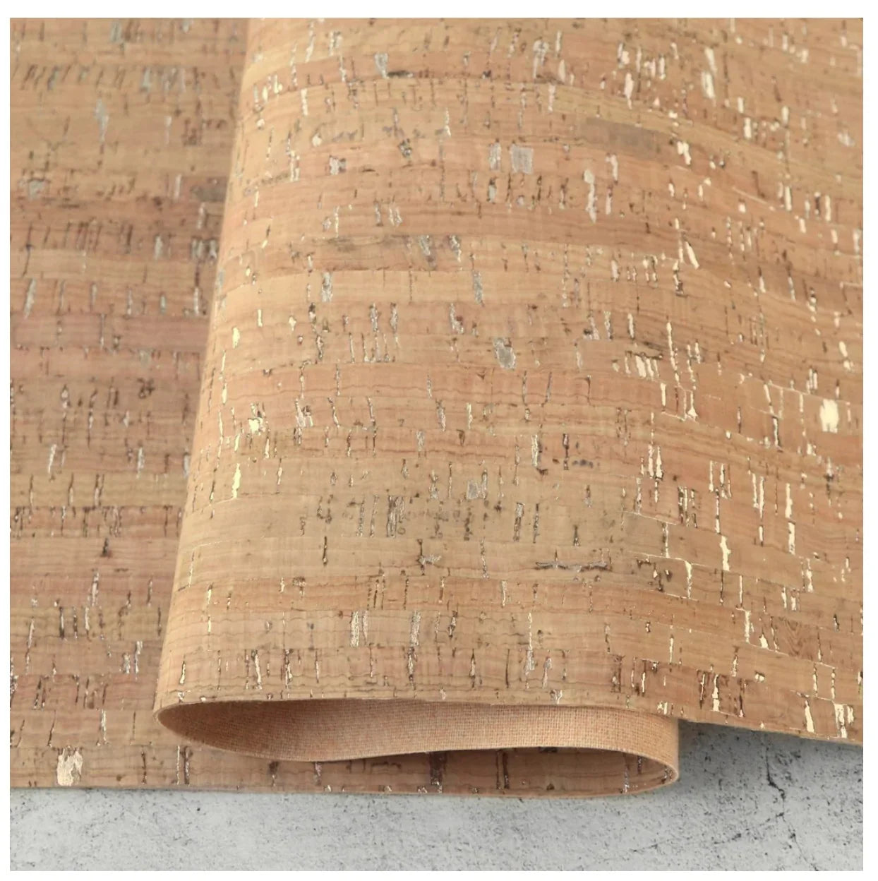 Natural cork fabric roll with silver flecks and textured weave