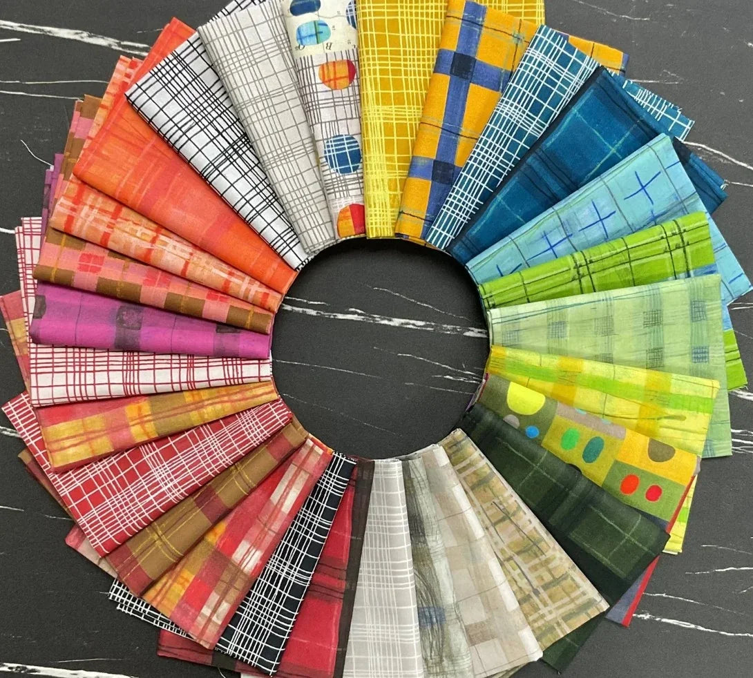 Plaid fabric assortment with folded swatches in bright multicolor checks