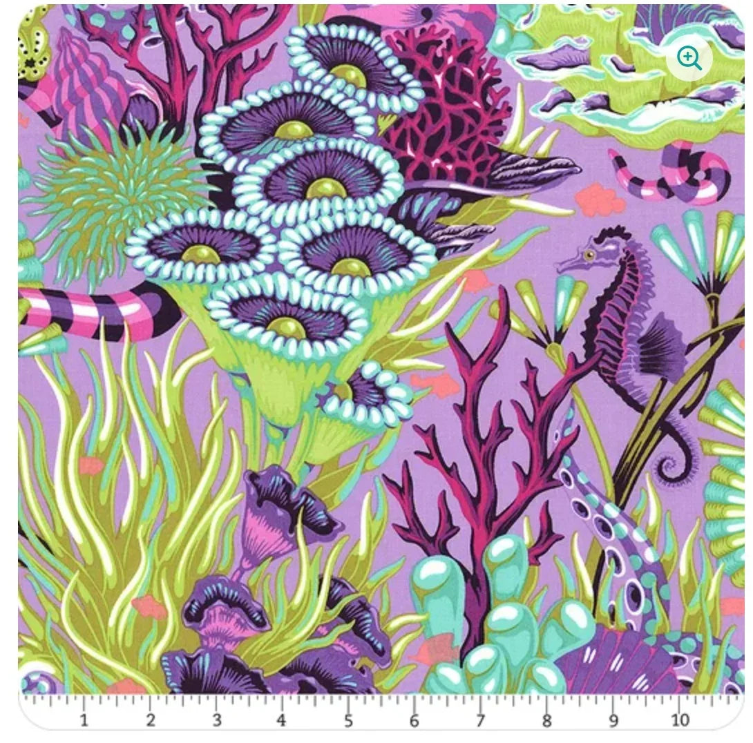 Ultraviolet floral reef fabric yardage with purple, pink corals, fish, and seaweed