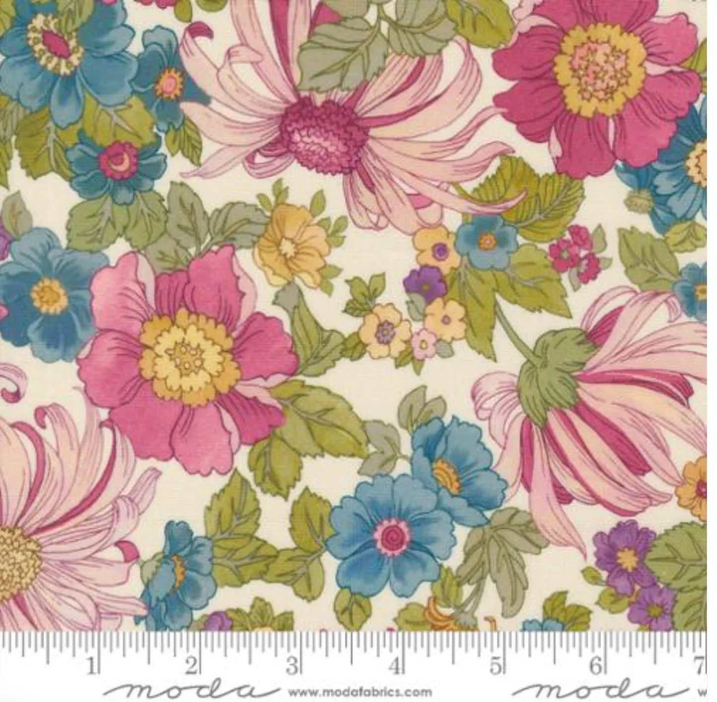 Floral cotton fabric with pink, blue, and yellow blossoms and green leaves