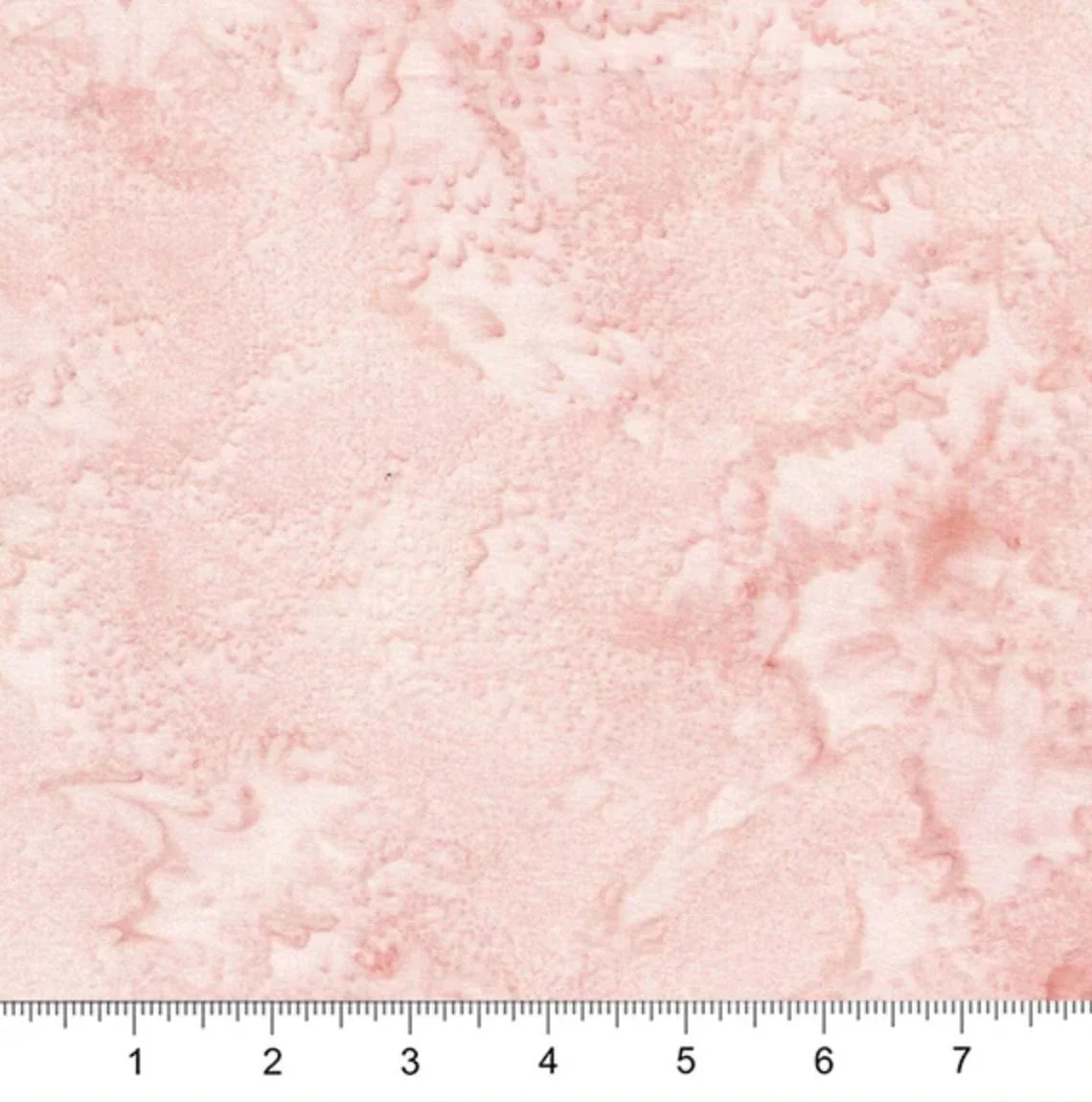 Blush pink quilt fabric with subtle red floral leaf motifs and light mottled texture