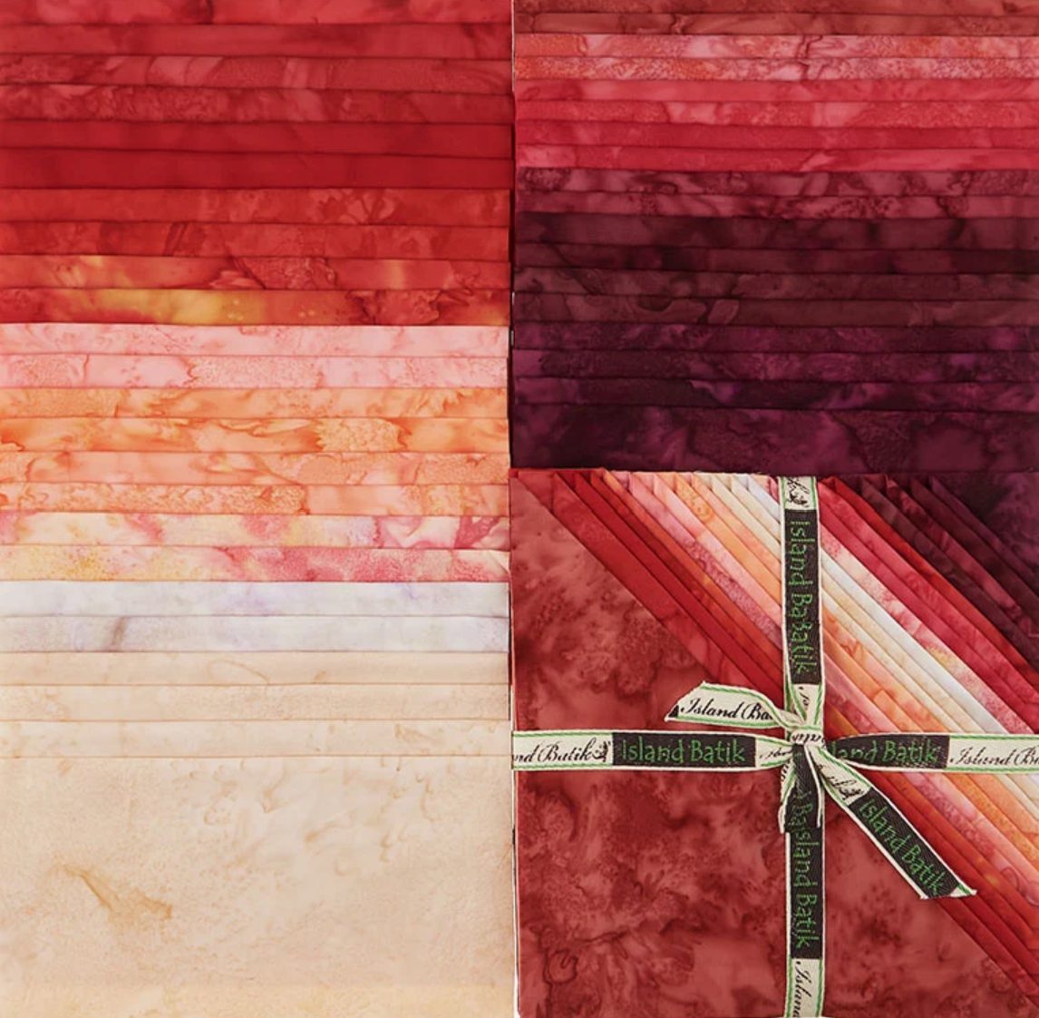 Batik fabric squares bundle, red and cream tones, folded in a stack with ribbon wrap