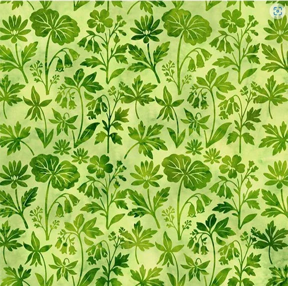 Green wildflower fabric with leaf silhouettes on light green background