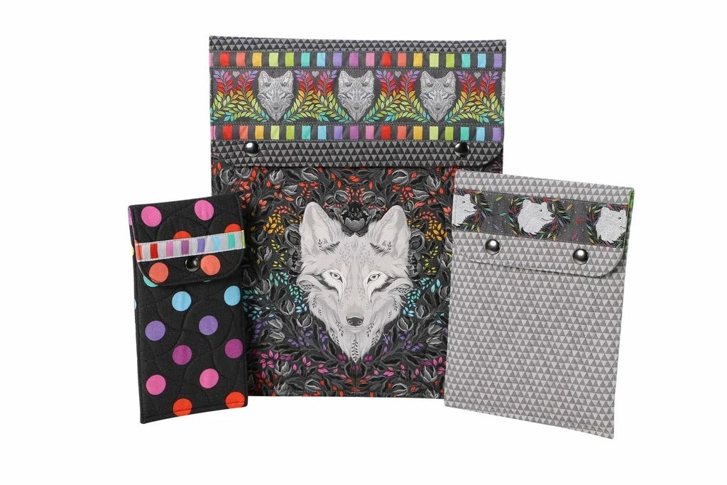 Four fabric snap sleeves with animal and polka-dot designs in black and gray