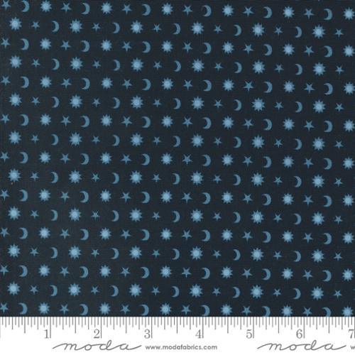 Navy blue fabric with repeating light blue stars, moons, and small sparkles