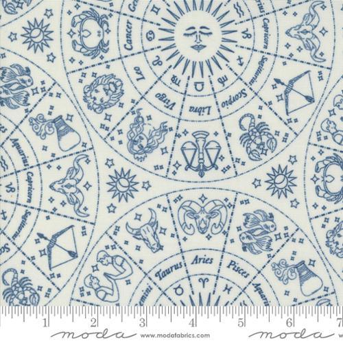 Cotton fabric with blue zodiac symbols and starburst motifs on white background