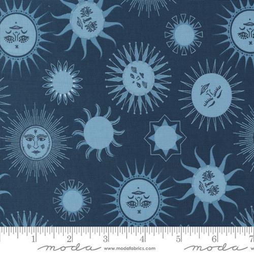 Blue celestial print cotton fabric with sun faces, small stars, and circular motifs