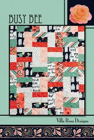 Busy Bee patchwork quilt by Villa Rosa Designs with multicolor squares and black text motifs