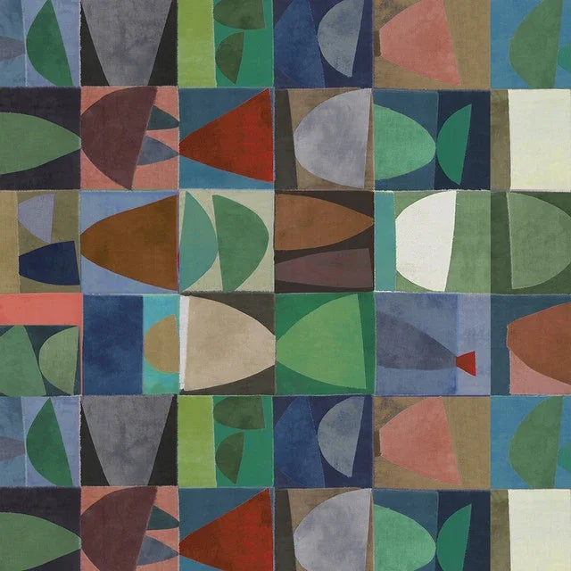 Abstract patchwork fabric with green, blue, and brown geometric leaf shapes
