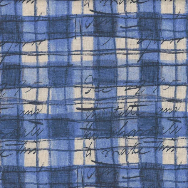 Blue plaid fabric with sketchy black marks and small lines