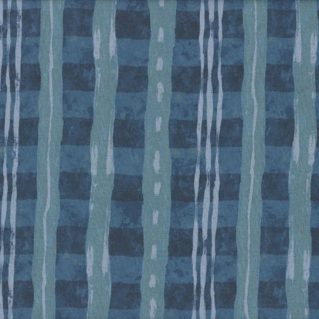 Blue abstract patchwork fabric with vertical ribbon stripes and light drips