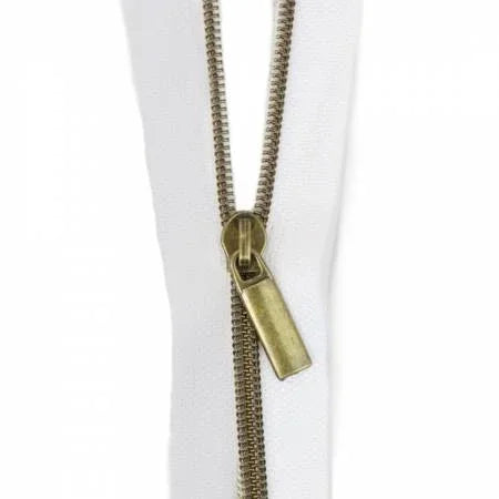 Nylon antique coil zipper with metal pull, dark brass tone.