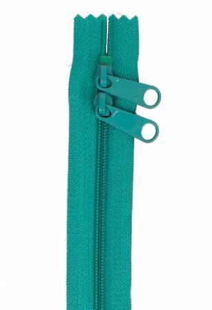 Emerald green double-slide zipper with two pull tabs on end tape
