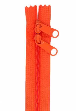 Tangerine zipper tape with pull slider and two metal grommets