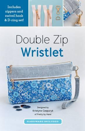Double zip wristlet pouch with blue floral fabric, gray wrist strap, and gold hardware