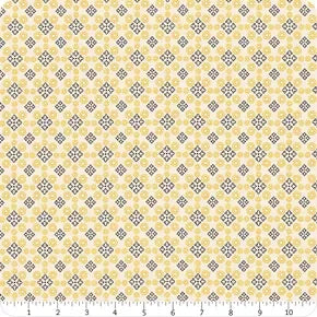 Cream cotton fabric with repeating medallion pattern in yellow and light blue