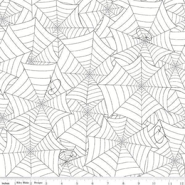 White spiderweb print fabric with outlined web motifs