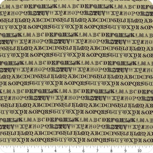 Green fabric yardage with repeating typewriter-style letter pattern