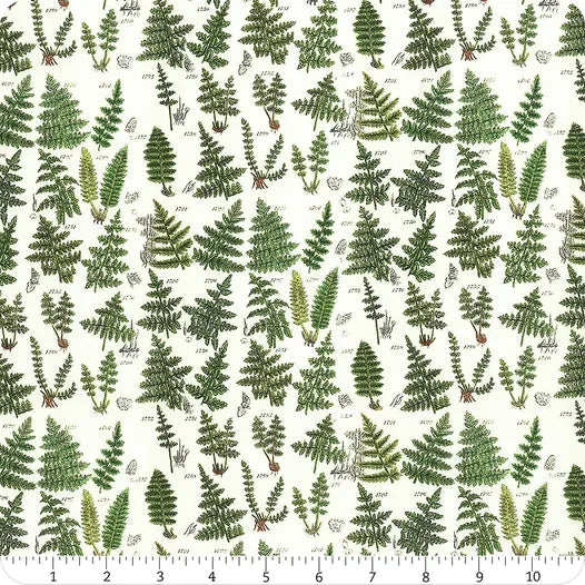 Fern print fabric yardage with green foliage on off-white background