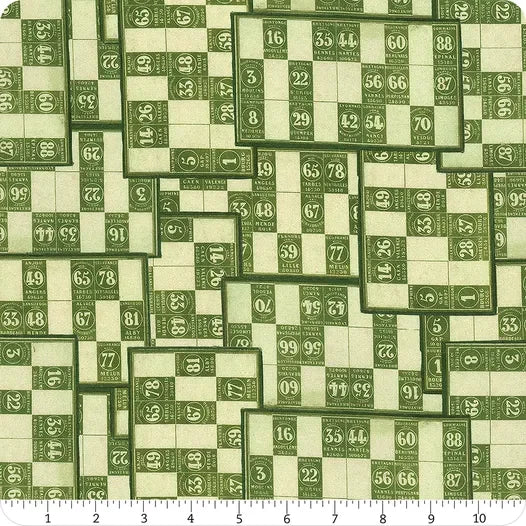 Green fabric yardage with scattered patchwork number blocks in dark and light greens