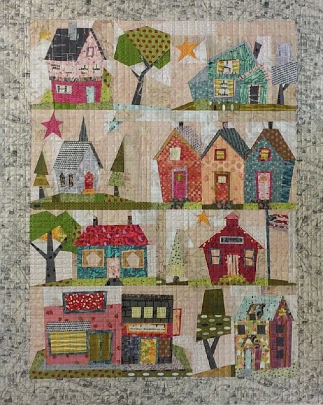 Foundation paper piecing quilt pattern with colorful house blocks, stars, and trees