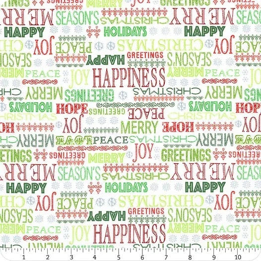 Ivory holiday greetings fabric yardage with multicolor text and ornaments pattern