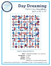 Quilt pattern booklet cover with patchwork blocks in red, blue, and white