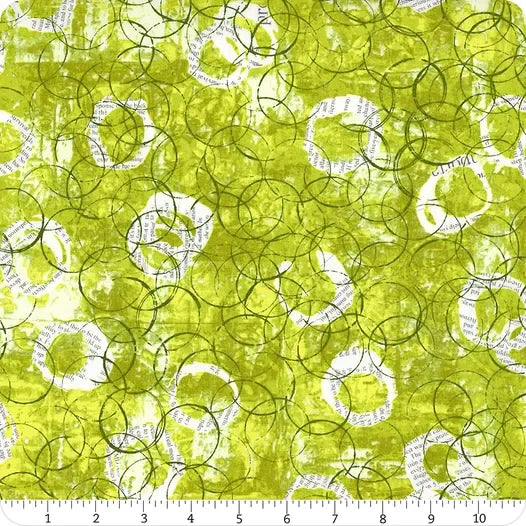Lime green printed cotton fabric with circular white patches and dark green loops