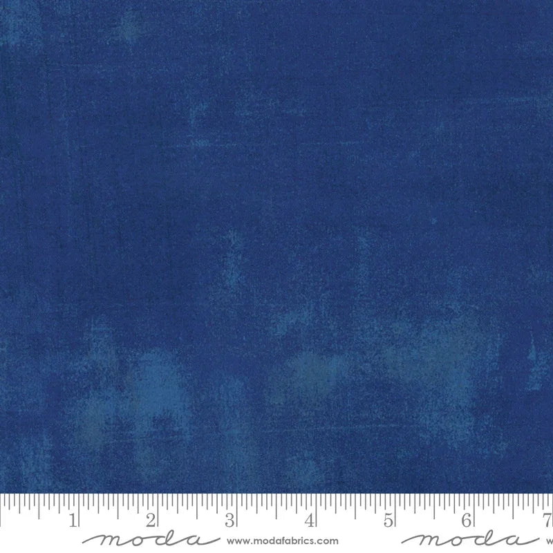 Blue grunge cotton fabric with mottled, distressed texture from Moda Fabrics