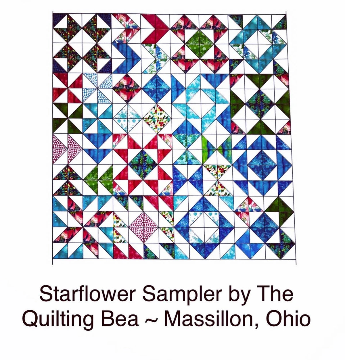 Colorful patchwork quilt top with star and diamond blocks in blue, red, black, and green.