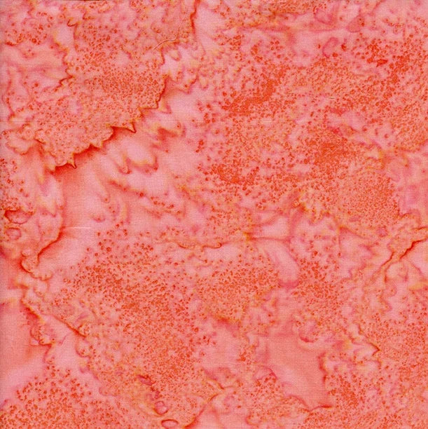 Batik fabric with coral and pink flamingo motif, textured swirl pattern