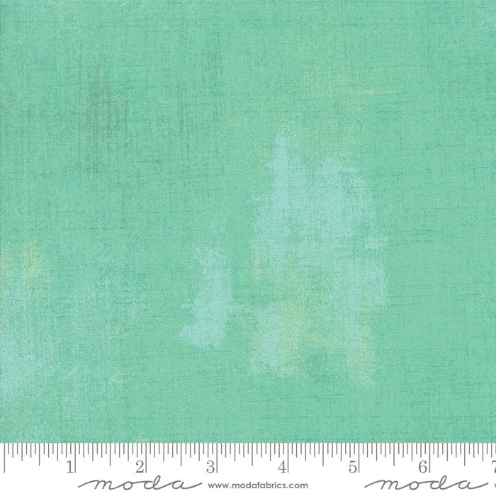 Aqua grunge fabric swatch with mottled abstract texture