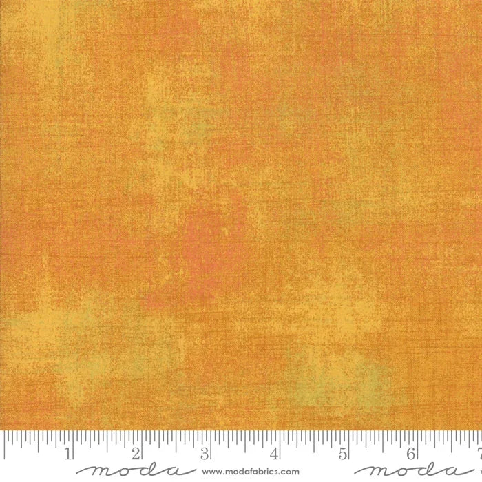 Butterscotch grunge cotton fabric, mottled tan texture for quilting and crafts.